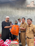 Image : Kadinsos Pekanbaru Salurkan Bantuan Korban Kebakaran di Marpoyan Damai